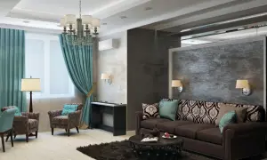 Elegancki salon z wygodną kanapą i fotelami, idealny na inwestycję w mieszkanie na wynajem.
