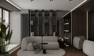 Nowoczesny salon z szarą sofą i okrągłym dywanem, inspirowany pracą projektantów wnętrz.