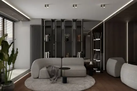 Nowoczesny salon z szarą sofą i okrągłym dywanem, inspirowany pracą projektantów wnętrz.