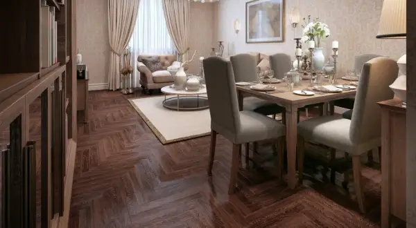 Eleganckie mieszkanie w stylu art deco z jadalnią i salonem. Drewniana podłoga w jodełkę, bogato zdobiony żyrandol i stylowe meble tworzą luksusową atmosferę.