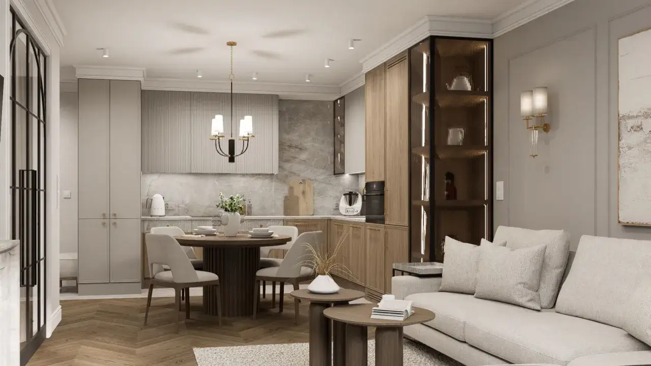 Przytulny salon z jadalnią w odcieniach kaszmiru. Drewniane meble, jasna sofa i okrągły stół tworzą ciepłą atmosferę.