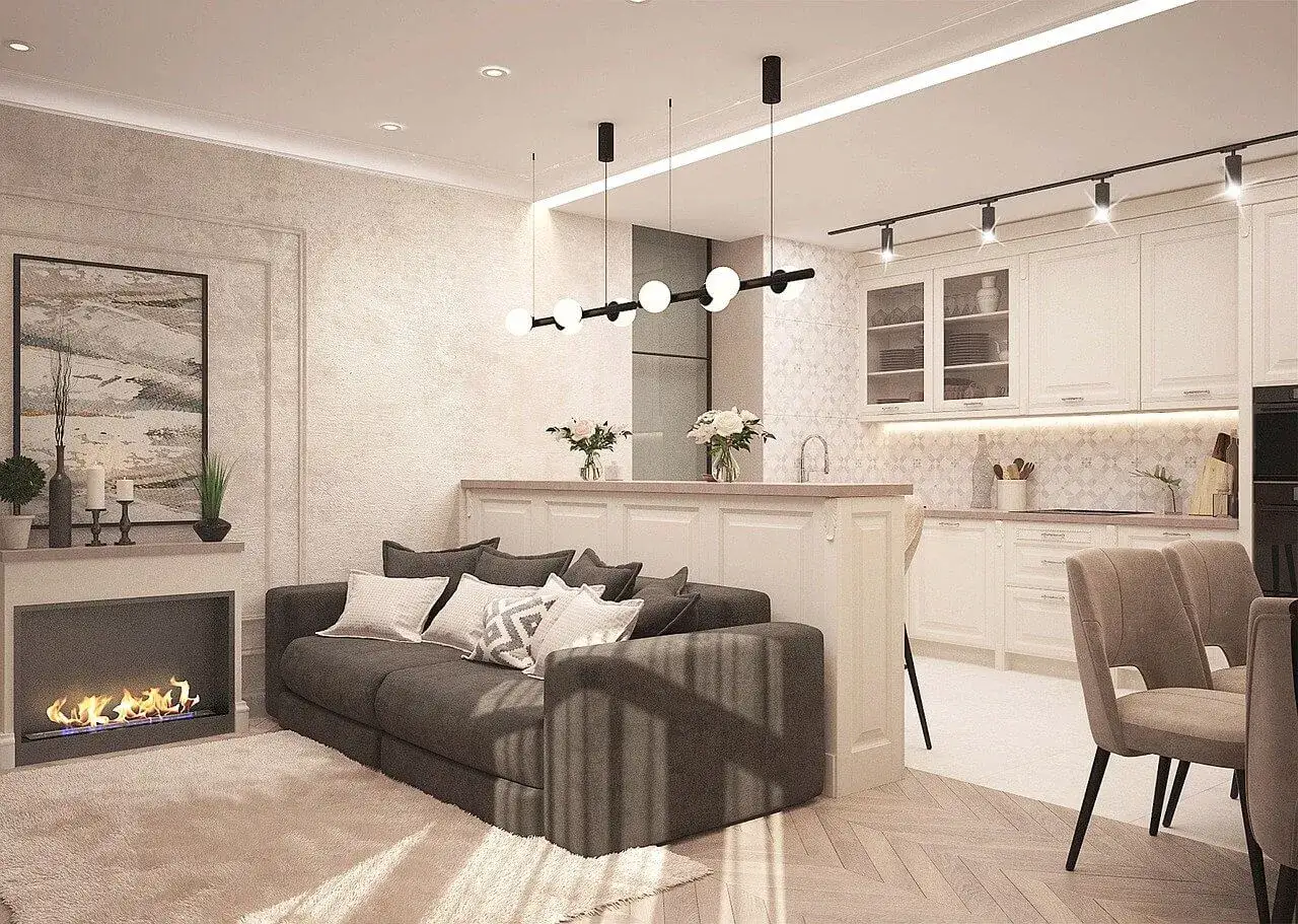 Jak urządzić małe mieszkanie 35 m: przytulny salon z kominkiem i nowoczesna kuchnia z wyspą.