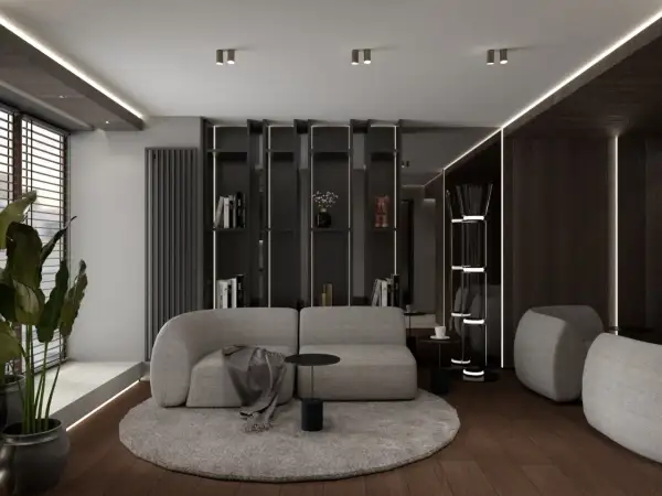 Nowoczesny salon z szarą sofą i okrągłym dywanem, inspirowany pracą projektantów wnętrz.